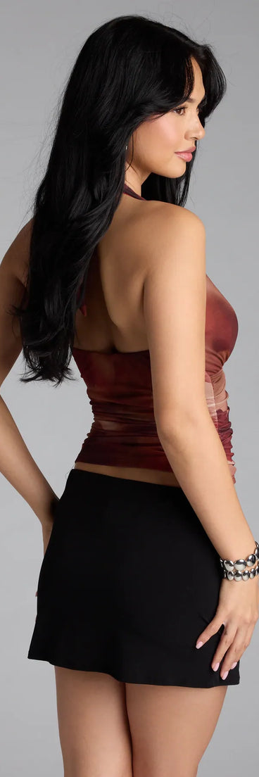 Complete your look with the In My Dreams Plunge Halter Abstract Crop Top, a trendy rust top that’s ready to pair with anything in your fall rotation.