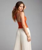 For college campus looks, game day outfits, or a bold going-out vibe, the Serving Vibes Halter Crop Top is an on-trend orange crop top that easily styles with your favorite denim.