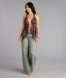 Trendy women’s tops, like the Spotted In Town Plunge Halter Top, bring effortless style for fall layering, lounging, or going out.