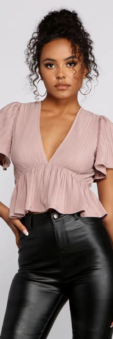 Pleated and Poised Peplum Blouse