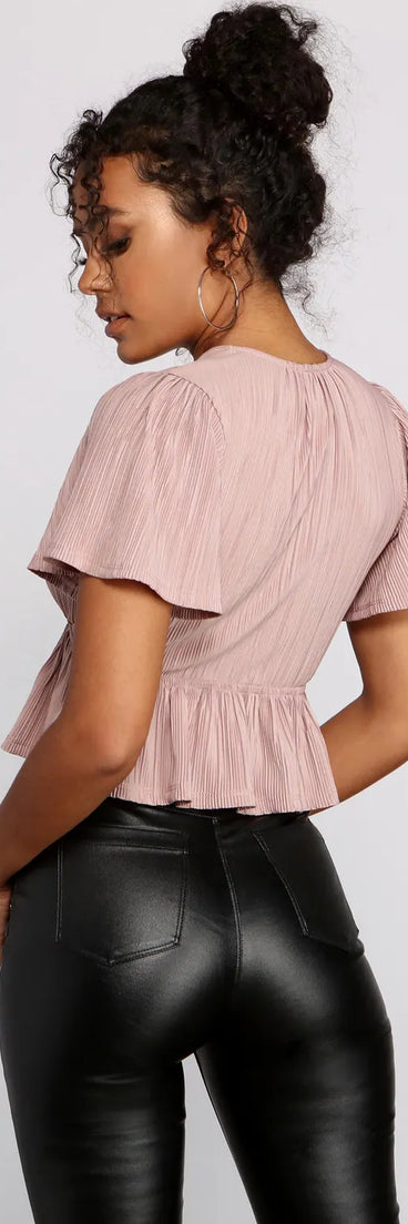 Pleated and Poised Peplum Blouse