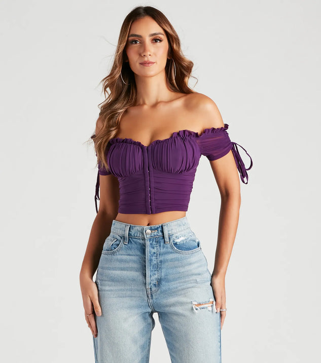 The Hooked In Ruched Crop Top in purple with a modern design and trendy look is part of the latest women's tops collection to elevate your 2025 wardrobe.
