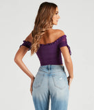 The Hooked In Ruched Crop Top in purple is a women's workwear piece offering a trendy style and unique accents, perfect for effortlessly creating an outfit-of-the-day look that transitions your office look to going-out ready.