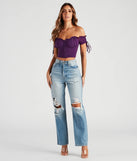 Stay on-trend this season with the Hooked In Ruched Crop Top in purple, a must-have for creating stylish and effortless fall outfits for women.