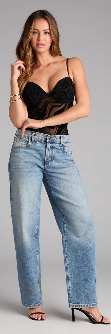 Complete your look with the Sexy Flair Sleeveless Flocked Velvet Mesh Bodysuit, a trendy black top that’s ready to pair with anything in your fall rotation.