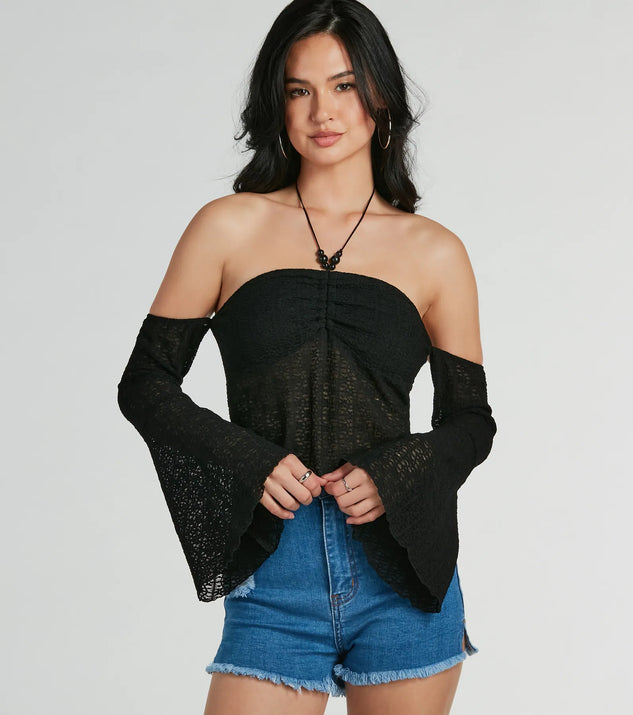Make a statement this winter with the Getaway Attitude Off-The-Shoulder Crochet Top, a black long-sleeve top featuring a trendy shoulder design that adds a bold, festive touch to any holiday or party look.
