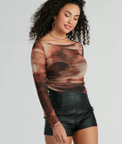 This women's brown long-sleeve top combines seasonal color with rich texture, offering a versatile style that's perfect for on-trend winter outfits.