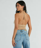 The Festive Icon V-Neck Fringe Halter Faux Suede Crop Top in beige with a modern design and trendy look is part of the latest women's tops collection to elevate your 2025 wardrobe.