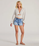 Stand out in 2025 in the Romance Awaits Long Sleeve Ruffle Lace Trim Crop Top, a women's ivory long-sleeve top crafted from an elevated fabric with a modern neckline perfect for party outfits, bridal shower attire, or elevated casual outfits.