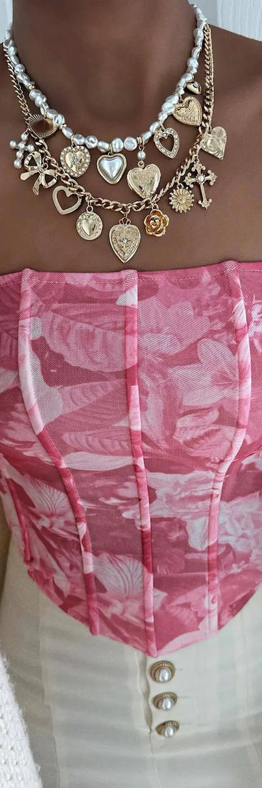 Serve effortless style and scroll-stopping energy in the Floral Sensation Strapless Crop Bustier, part of a pink matching clothing set that does the work for you with bold, polished vibes from top to bottom.