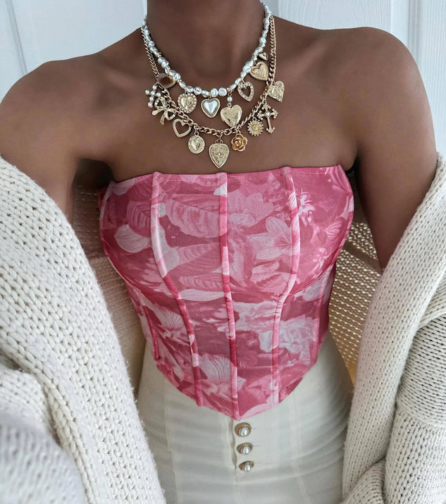 Stay on-trend this season with the Floral Sensation Strapless Crop Bustier in pink, a must-have for creating stylish and effortless spring outfits for women.