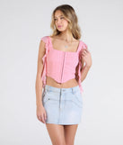 Stay on-trend this season with the Such A Cutie Ruffled Strap Corset Top in pink, a must-have for creating stylish and effortless spring outfits for women.
