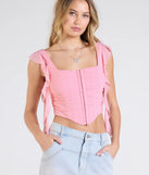 Stay on-trend this season with the Such A Cutie Ruffled Strap Corset Top in pink, a must-have for creating stylish and effortless spring outfits for women.