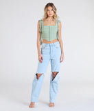 Stay on-trend this season with the Such A Cutie Ruffled Strap Corset Top in sage green, a must-have for creating stylish and effortless summer outfits for women.