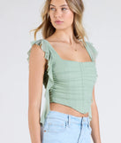 Stay on-trend this season with the Such A Cutie Ruffled Strap Corset Top in sage green, a must-have for creating stylish and effortless summer outfits for women.