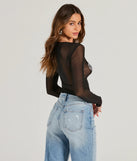 The Flirt Alert Rhinestone Heart Sheer Mesh Crop Top in black is a sequin top with an all-over sparkle, perfect for creating a glam concert outfit or adding shimmer to a going-out look. 