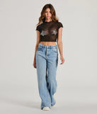 The Born Star Rhinestone Sheer Mesh Crop Top in black is a holiday-ready sequin top with an all-over sparkle, perfect for creating a glam NYE outfit or adding shimmer to a festive holiday look. 