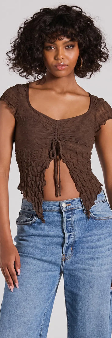 The Flirty Expert Short Sleeve Slit Texture Crop Top in brown with a modern design and trendy look is part of the latest women's tops collection to elevate your 2025 wardrobe.