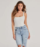 The Stunning Persuit Sleeveless Cross Back Bodysuit in ivory with a modern design and trendy look is part of the latest women's tops collection to elevate your 2025 wardrobe.