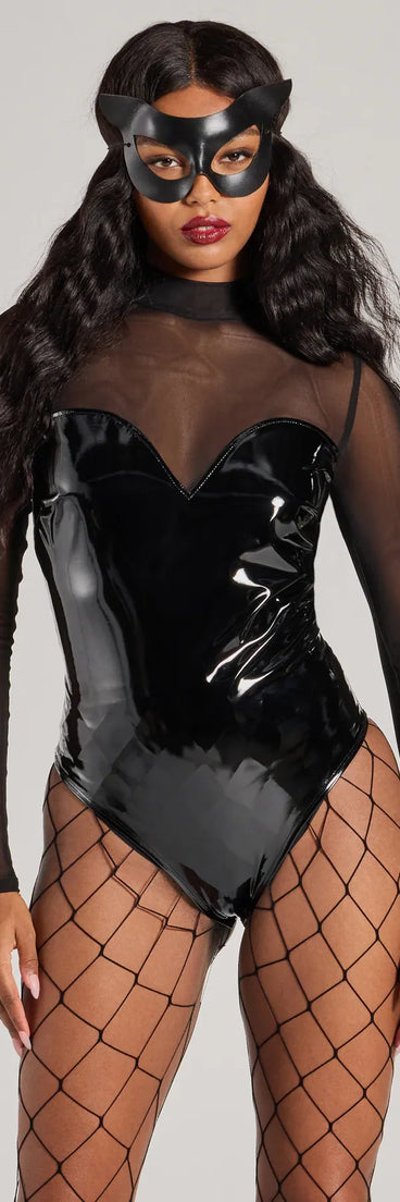 This women's black long-sleeve top combines seasonal color with rich texture, offering a versatile style that's perfect for on-trend winter or holiday outfits.