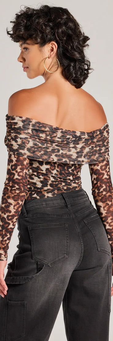 Make a statement this winter with the Trendy Chic Leopard Print Mesh Off-The-Shoulder Top, a leopard long-sleeve top featuring a trendy shoulder design that adds a bold, festive touch to any club or party look.