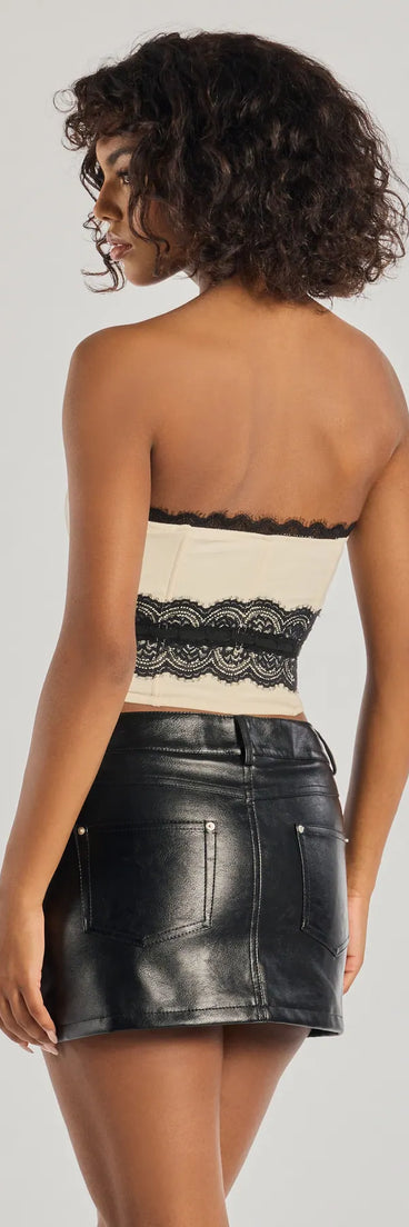 The Delicate Glam Corset Lace Ribbon Top in ivory with a modern design and trendy look is part of the latest women's tops collection to elevate your 2025 wardrobe.