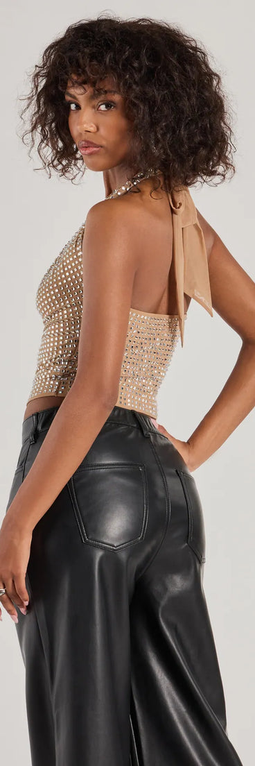 With its midriff cut and trend-forward fit, the Glitzy Chic Cropped Rhinestone Halter Top is a nude crop top made to pair with skirts, denim, or whatever vibe you're feeling this season.