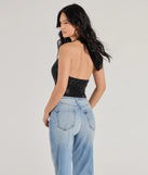 The Glitzy Chic Cropped Rhinestone Halter Top in black is a sequin top with an all-over sparkle, perfect for creating a glam concert outfit or adding shimmer to a going-out look. 