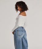 Make a statement in 2025 with the Adorable Flirt Off-The-Shoulder Knit Top, a ivory long-sleeve top featuring a trendy shoulder design that adds a bold, festive touch to any club or party look.