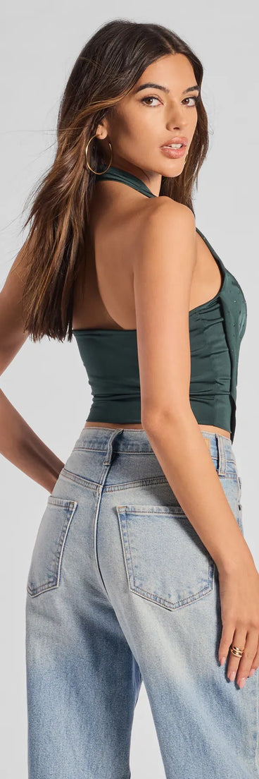 With its midriff cut and trend-forward fit, the Sultry Flair Rhinestone Knit Halter Crop Top is a emerald green crop top made to pair with skirts, denim, or whatever vibe you're feeling this season.