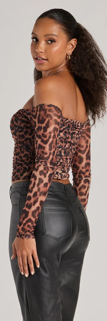 Make a statement in 2025 with the Sultry Leopard Print Mesh Off-The-Shoulder Top, a leopard long-sleeve top featuring a trendy shoulder design that adds a bold, festive touch to any club or party look.