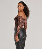 Make a statement in 2025 with the Sultry Leopard Print Mesh Off-The-Shoulder Top, a leopard long-sleeve top featuring a trendy shoulder design that adds a bold, festive touch to any club or party look.