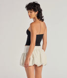 The Adorable Glam Rhinestone Bow Cutout Corset Top in black is an elevated pick for your best outfit yet, effortlessly delivering a polished look that's sure to turn heads at any celebration.