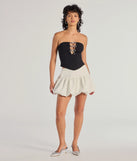 The party-ready Adorable Glam Rhinestone Bow Cutout Corset Top is a black going-out top showcasing a seasonal color and modern silhouette to create outfits for date nights, cocktail parties, or clubwear.