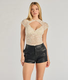 The Sultry Glam Cutout Lace Bodysuit in ivory with a modern design and trendy look is part of the latest women's tops collection to elevate your 2025 wardrobe.