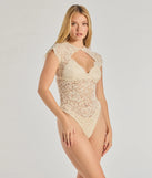 The Sultry Glam Cutout Lace Bodysuit in ivory with a modern design and trendy look is part of the latest women's tops collection to elevate your 2025 wardrobe.