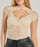 The Sultry Glam Cutout Lace Bodysuit in ivory with a modern design and trendy look is part of the latest women's tops collection to elevate your 2025 wardrobe.
