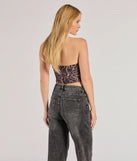 The party-ready Roaring Glam Sleeveless Leopard Print Cropped Corset is a leopard print going-out top showcasing a seasonal color and modern silhouette to create outfits for date nights, cocktail parties, or clubwear.