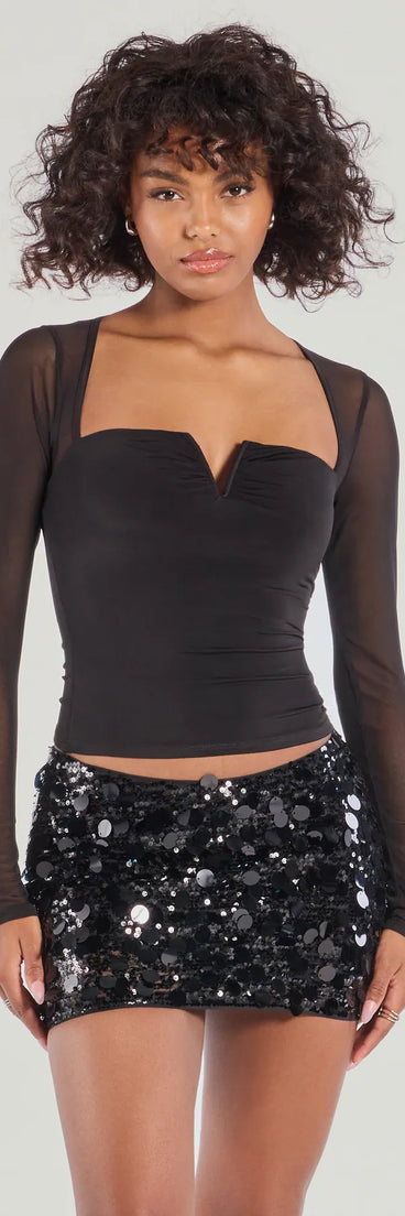 The Boldly Chic Open Back Long Sleeve Top in black with a modern design and trendy look is part of the latest women's tops collection to elevate your 2025 wardrobe.