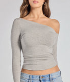 The Chic Factor Asymmetrical Long Sleeve Crop Top in heather gray with a modern design and trendy look is part of the latest women's tops collection to elevate your 2025 wardrobe.