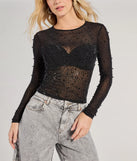 
Upgrade your style game for 2025 with the Sheer Glitz Long Sleeve Beaded Rhinestone Crop Top in black, perfect for any fashion-forward wardrobe.