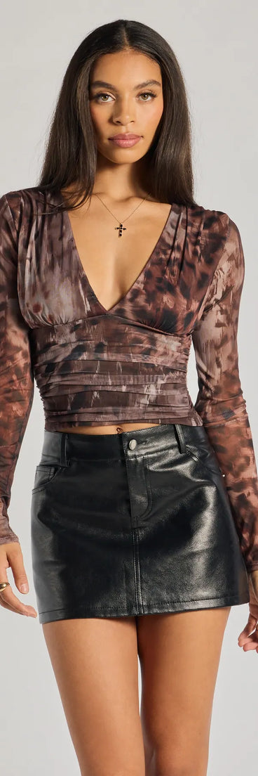 From bold to effortless, the Sassy Style Print Mesh Long Sleeve Top lets you define your vibe with multi-color tops that speak your style.