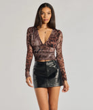 From bold to effortless, the Sassy Style Print Mesh Long Sleeve Top lets you define your vibe with multi-color tops that speak your style.