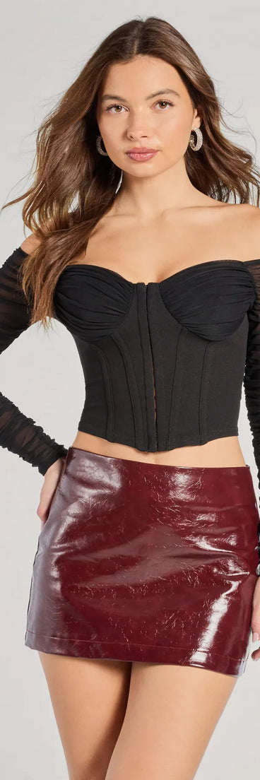 The Downtown Looks Long Sleeve Mesh Bustier in black with a modern design and trendy look is part of the latest women's tops collection to elevate your 2025 wardrobe.