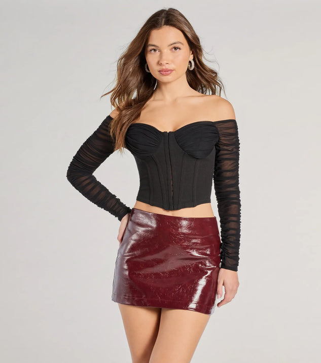 The Downtown Looks Long Sleeve Mesh Bustier in black with a modern design and trendy look is part of the latest women's tops collection to elevate your 2025 wardrobe.