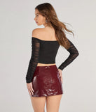 Perfect for creating a fashionable Valentine's Day outfit, the Downtown Looks Long Sleeve Mesh Bustier is a chic black top with romantic and modern flair, ideal for date night or Galentine’s celebrations.
