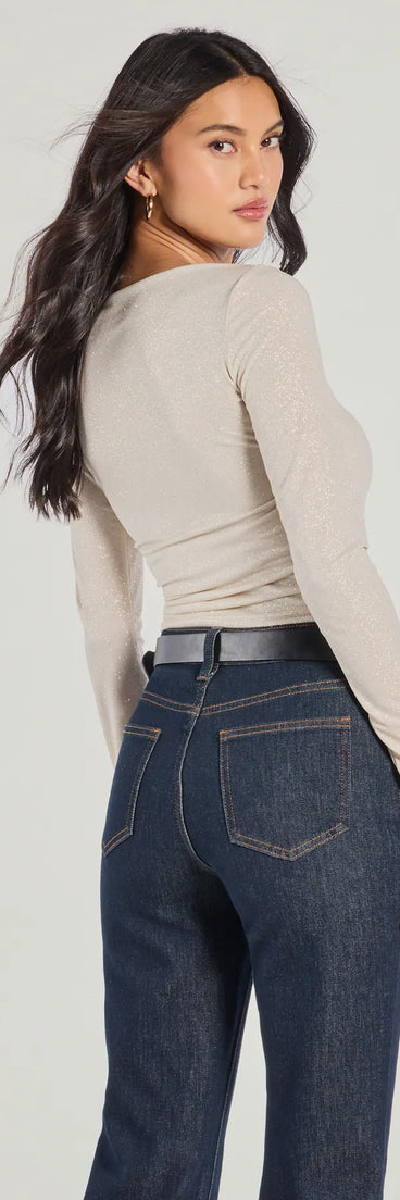 The Love To Shine Glitter Long Sleeve Top in gold with a modern design and trendy look is part of the latest women's tops collection to elevate your 2025 wardrobe.