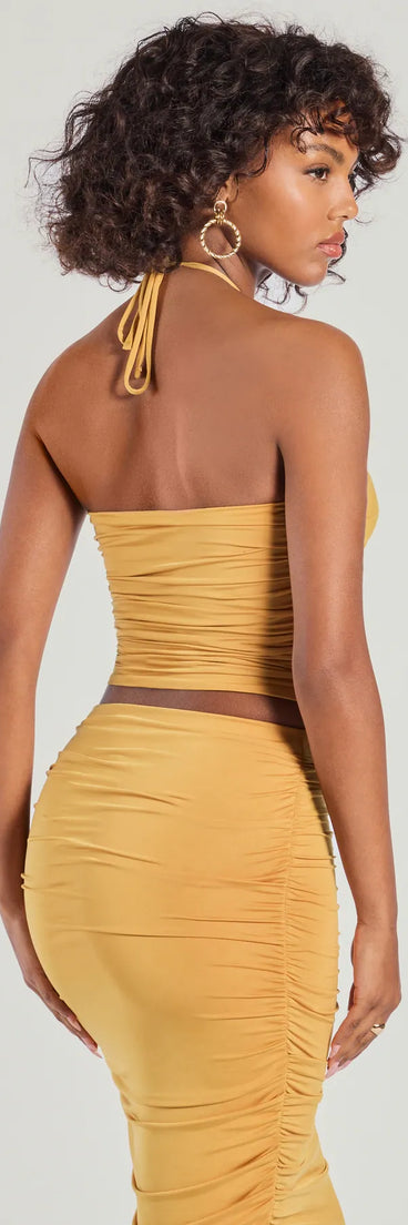 Serve effortless style and scroll-stopping energy in the Coastal Escape Cropped Halter Top, part of a gold matching clothing set that does the work for you with bold, polished vibes from top to bottom.