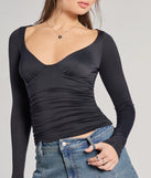 The Updated Basic V-Neck Long Sleeve Crop Top in black with a modern design and trendy look is part of the latest women's tops collection to elevate your 2025 wardrobe.