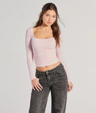 The Elevated And Cute Long Sleeve Ruched Crop Top in pink with a modern design and trendy look is part of the latest women's tops collection to elevate your 2025 wardrobe.